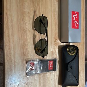 Brand new Ray-Ban Aviator sunglasses with case, cleaning cloth in original box.